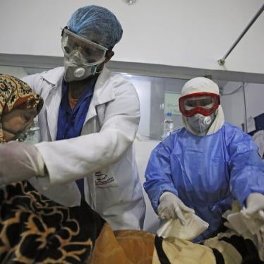 Medical workers attend to a Covid-19 patient in an intensive care unit at a hospital in Sanaa, Yemen, June 14, 2020. 