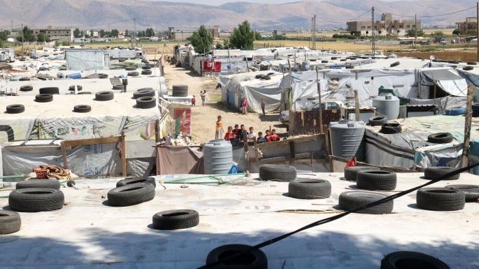 Syrian children gather between tents at a refugee camp in Saadnayel in eastern Lebanon's Bekaa Valley, June 13, 2023.