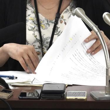 A plaintiff  speaks during a news conference at Tokyo District Court, Tokyo, Japan, July 11, 2023. 