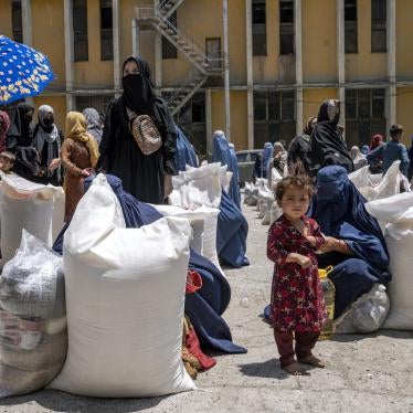 Afghan women receive food rations distributed by a humanitarian aid group, in Kabul, Afghanistan, May 28, 2023.