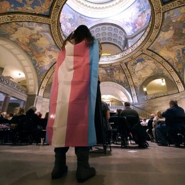 An activist wears a the transgender pride flag as a counter protest during a rally in favor of a ban on gender-affirming health care legislation at the Missouri Statehouse in Jefferson, US, March 20, 2023.