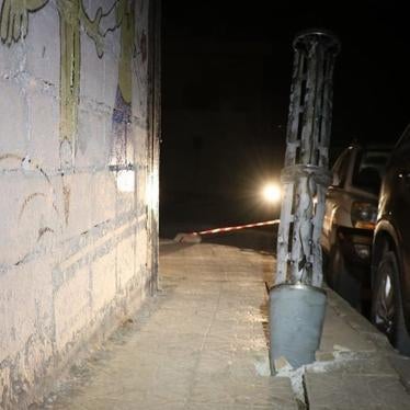 Remnant of an expended cargo section of one of the two 220mm 9M27K-series Uragan surface-launched cluster munition rockets embedded into the ground after it scattered its payload of explosive submunitions on a sidewalk next to a boys’ school in the town of Termanin, Syria 2023.