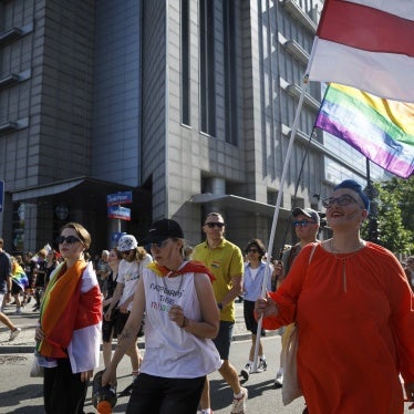 Belarusian LGBTQ activists with white-red-white flags participate in the Warsaw Equality Parade, June 25, 2022.