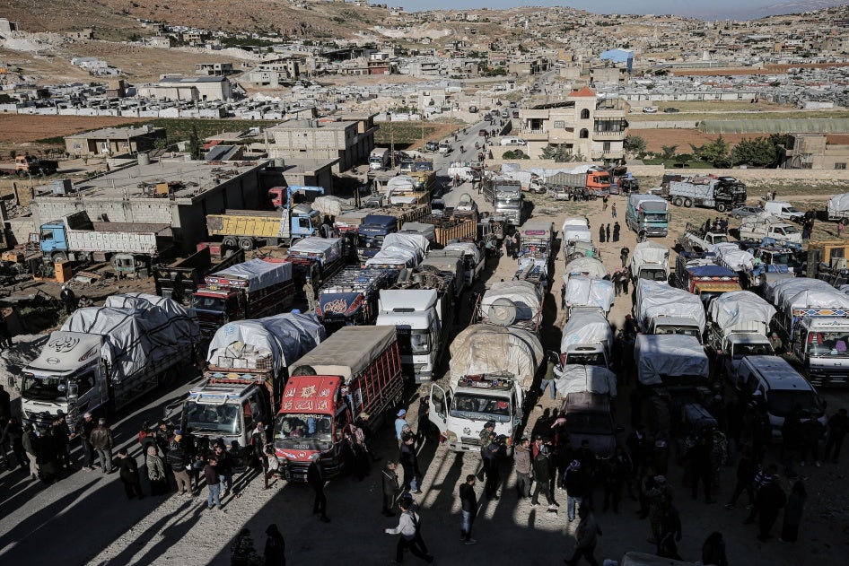 Syrian refugee trucks and cars prepare to leave Lebanon back to Syria, May 14, 2024. 