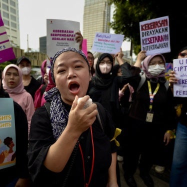 Indonesian women march to demand the Indonesian government enacts an anti-discrimination law and to advocate for ending sexual violence and harassment at work, March 8, 2024.