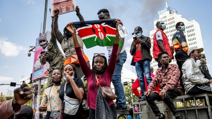 A protester holds a Kenyan flag during the nationwide demonstration against proposed legislation which would increase taxes across the country's economy.