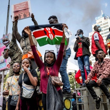 A protester holds a Kenyan flag during the nationwide demonstration against proposed legislation which would increase taxes across the country's economy.